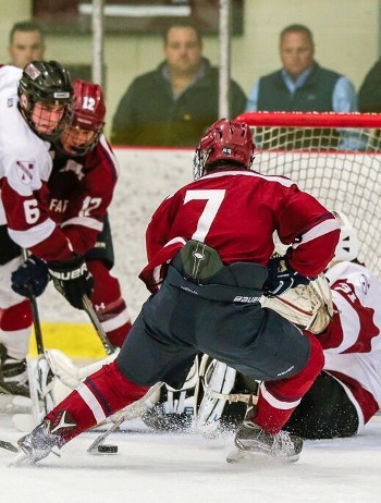 Gunnery senior G Trevin Kozlowski has his hands full with Avon's Patrick Harper in Wednesday action. Harper was kept off the board, but Avon won 5-3.