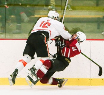 KUA senior D Ben Finkelstein halts the forward progress of Exeter freshman F Garrett Foster in the Wildcats' 8-3 win Wednesday.