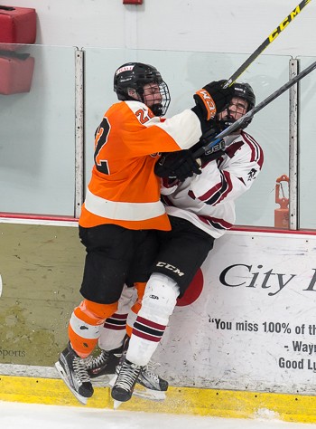 Thayer junior Casey Carreau -- the Tigers' leading goal scorer -- gets physical in Wednesday's 5-3 quarterfinal win over Tabor.