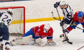 In semifinal action at the True Prep Cup Saturday at Merrimack College, Mount St. Charles goaltender Bennett Jung denies Northwood's Will Donato (#24)